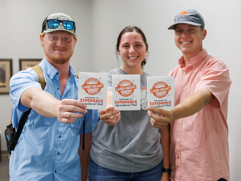 1-land-grant-week-teaching-600x800.jpg Students holding passports during teaching day