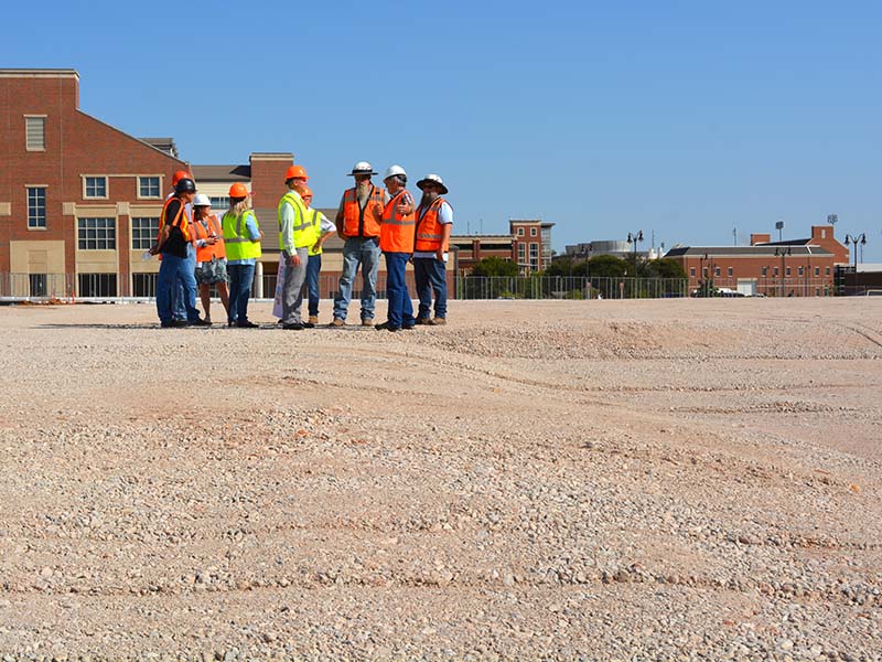 Group walking the building site