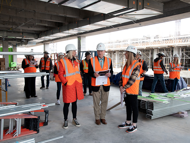 Kayse Shrum, Tom Coon and Jeanette Mendez on hard hat tour