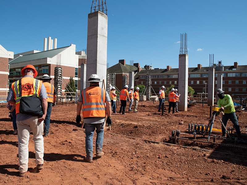 Faculty and staff walking the site