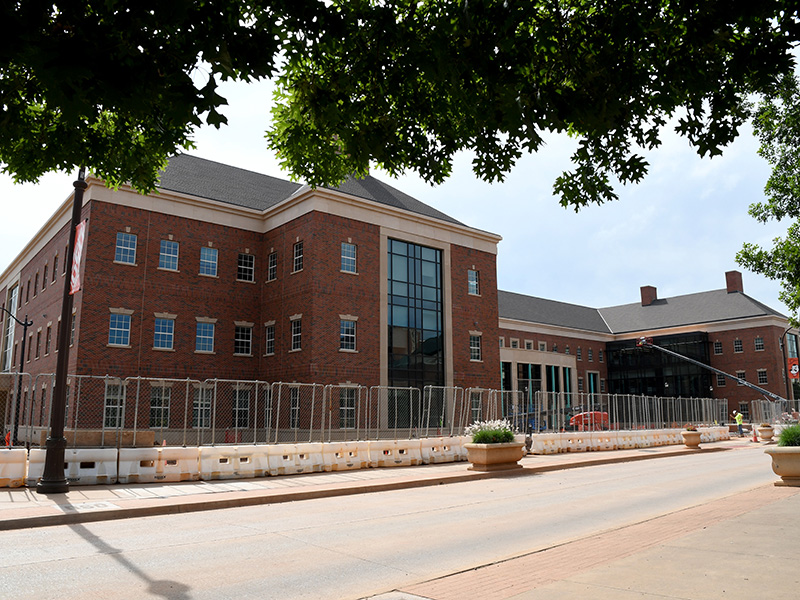 view of building from north side and trees hanging down