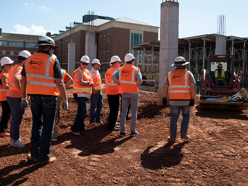 faculty and staff tour the construction site