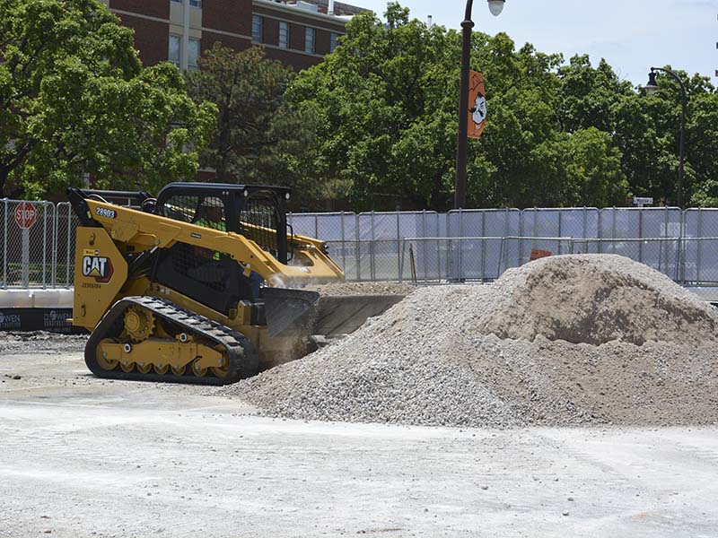 Moving gravel during parking lot demolition
