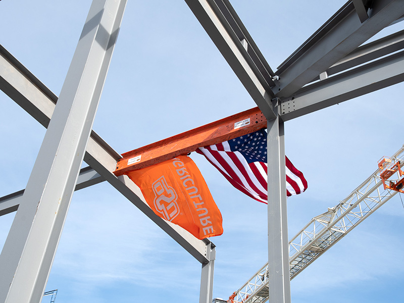 Installed signed beam with OSU Ag and American flags flying